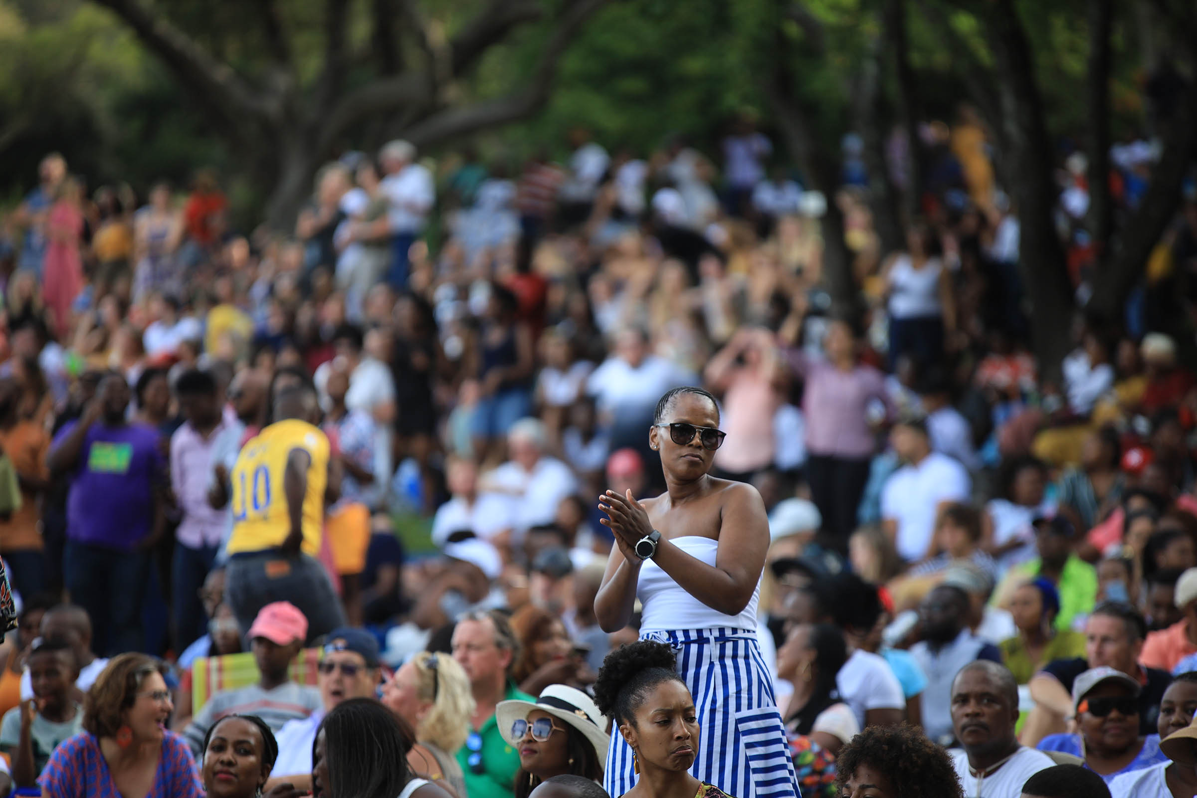 Lady standing in the crowd at a Kirstenbosch Concert